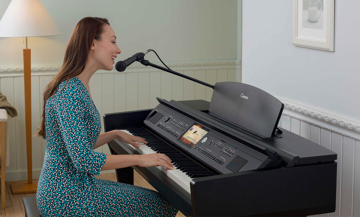 A woman playing a Clavinova digital piano