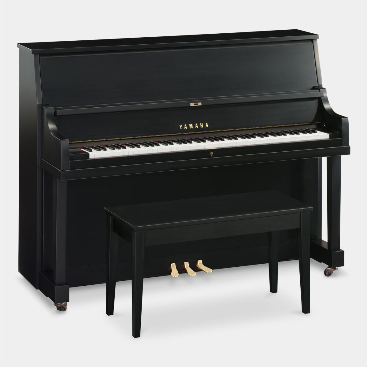 Yamaha upright piano in ebony, showcasing elegant craftsmanship and rich tone quality. Perfect for homes and studios.