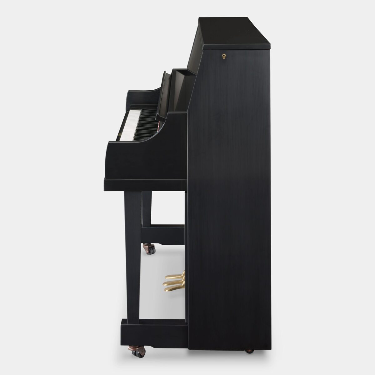 Side view of a Steinway upright piano in ebony finish, highlighting a sleek, compact design for enhanced home acoustics.