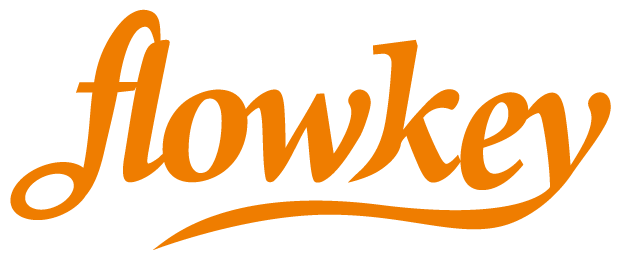 Flowkey logo in orange script, a popular music learning app recommended by Classic Pianos Seattle for piano enthusiasts.