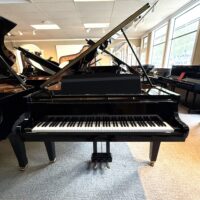 High-gloss Kawai grand piano showcasing a polished finish, suitable for professional performance and practice.